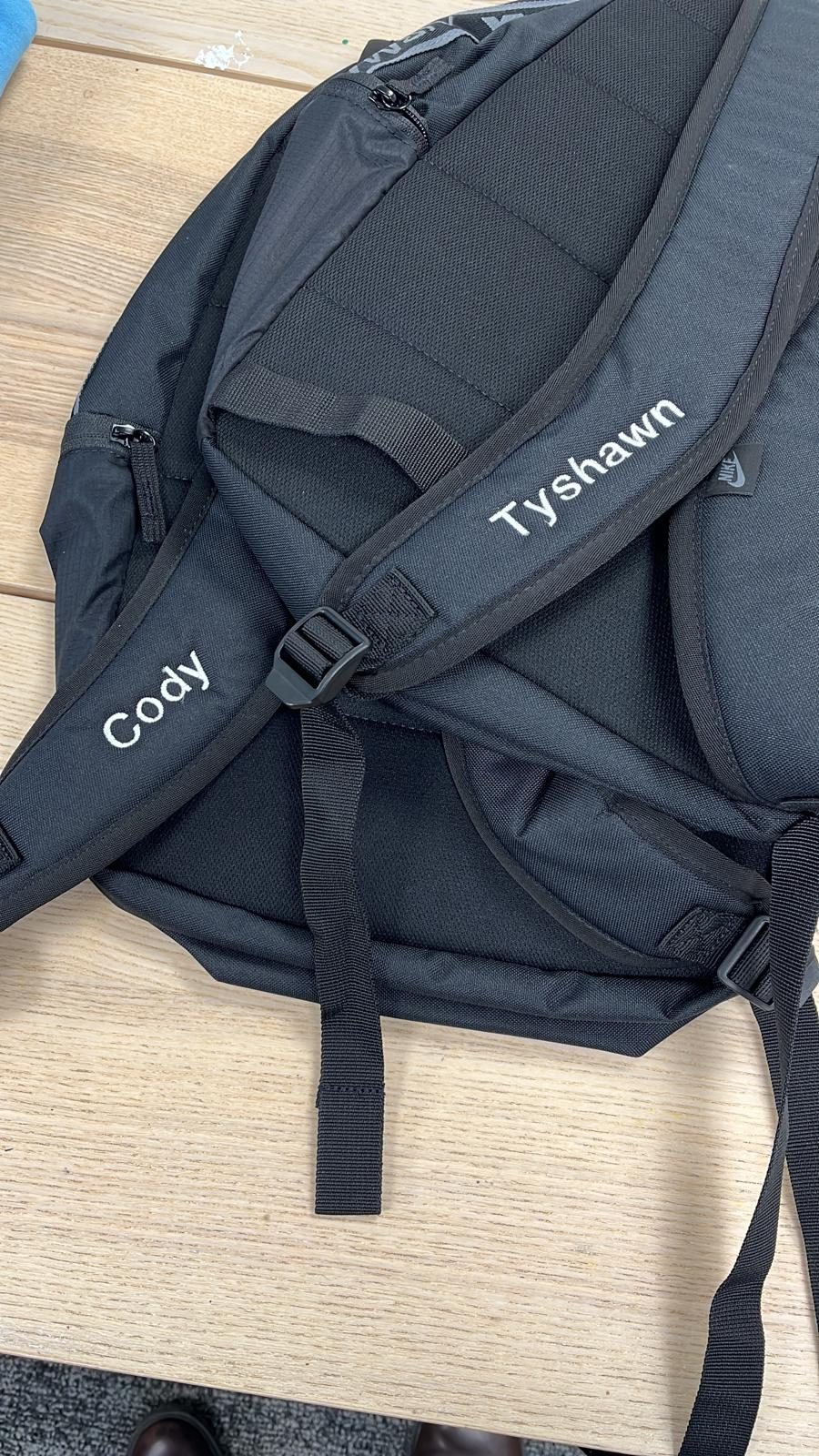 Black school or gym backpacks personalised with the embroidered names Cody and Tyshawn by SVP Southend Embroidery